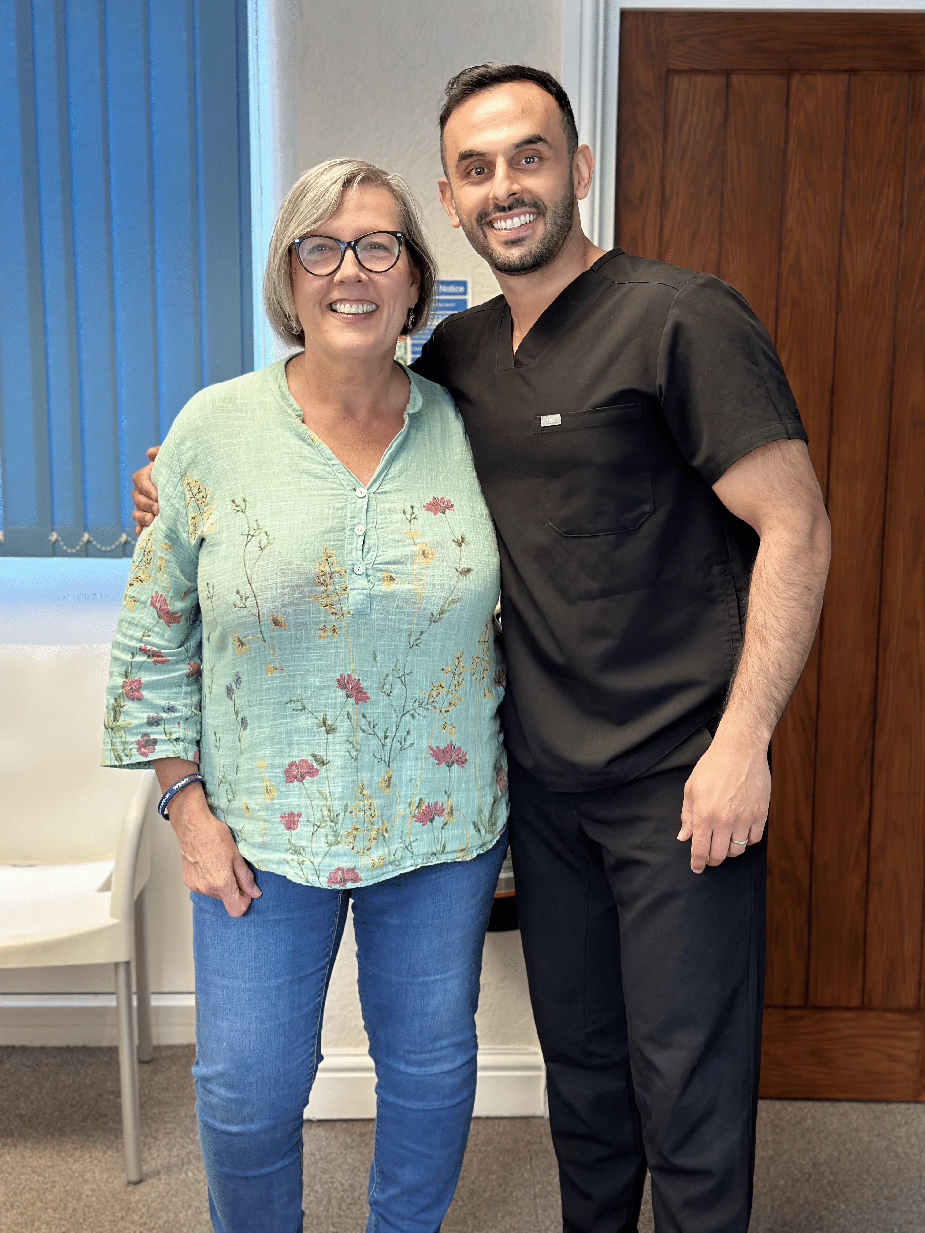 photograph of Dr. Nadeem Sabir with dental implant patient